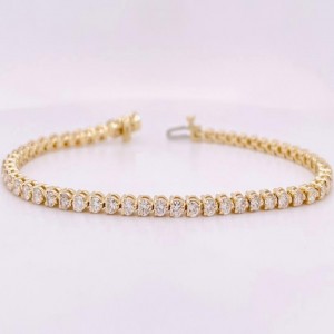 14 Karat Yellow Gold Tennis Bracelet With 2.67Tw RoundDiamonds 
Length/Size: 7