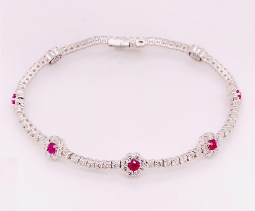 14 Karat White Gold  Tennis Station Bracelet With 7=0.68CT Round Ruby Gemstones And 117= 2.73CT Round H/I Si1-2 Diamonds
Length: 7