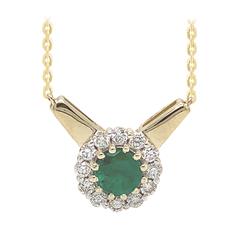 14 Karat Yellow Gold Halo Necklace With One 0.41Ct Oval Emerald And 12= Round Diamonds 0.21 CT
Length: 18